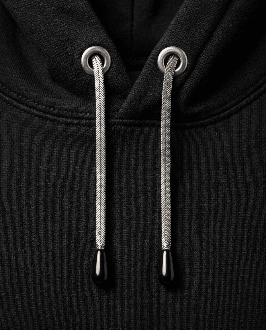 Black hoodie with polished stainless herringbone drawcords.